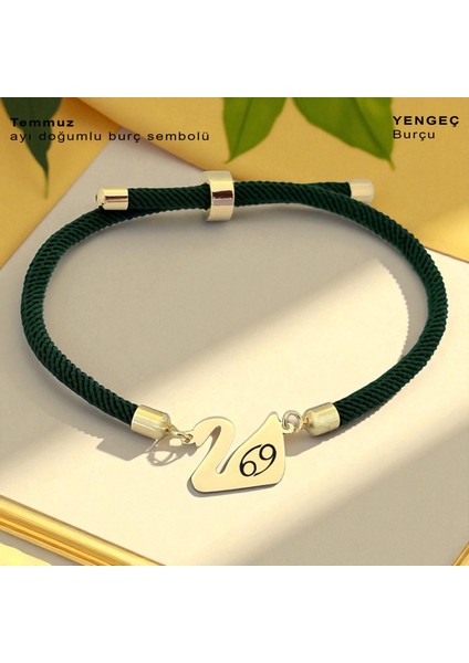 Altın Plakalı 14 Ayar Temmuz Ayı Doğumlarına Kuğu Kuşu Figürlü Yeşil Örgülü Hediye BILEKLIK-607AY fiyatları