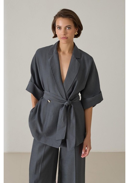 Petrol Düğme Ve Belden Bağlama Detaylı Geniş Kalıp Yarım Kollu Ceket fırsatları