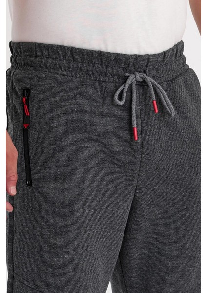 Erkek Paça Kendinden Kıvırma Lastikli Dizi Parçalı Eşofman Altı fiyatları