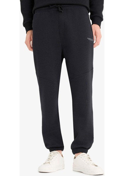 Regular Fit Beli Bağcıklı İçi Yumuşak Tüylü Paçası Lastikli Baskılı Fermuar Cepli Eşofman Altı Y5511AZ25AU fırsatları