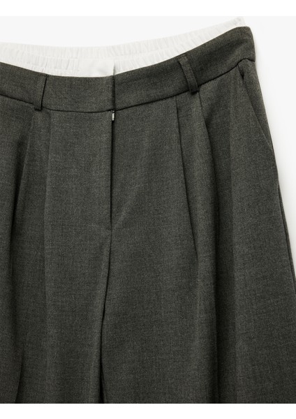 Cepli Pile Detaylı Geniş Paça Baggy Kumaş Pantolon modelleri