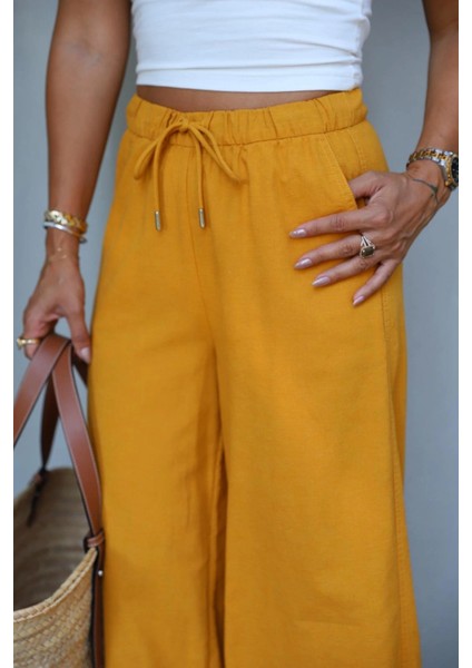 Hardal Beli Lastikli Bol Paça Keten Pantolon fırsatları