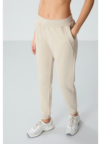 Bej Kompakt Pamuklu Kalın Pürüzsüz Dokulu Standart Fit Kadın Eşofman Altı - 94660 fiyatları