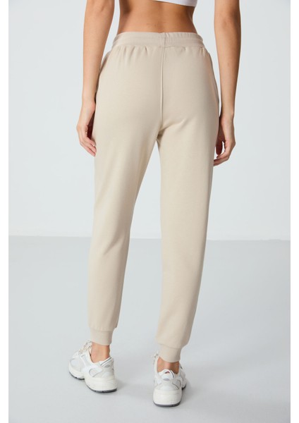 Bej Kompakt Pamuklu Kalın Pürüzsüz Dokulu Standart Fit Kadın Eşofman Altı - 94660 indirimleri