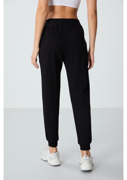 Siyah Kompakt Pamuklu Kalın Pürüzsüz Dokulu Standart Fit Kadın Eşofman Altı - 94660 indirimleri