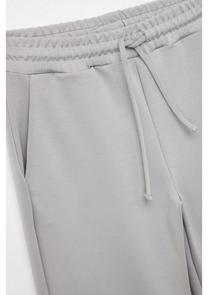 Yüksek Bel Cep Detaylı Beli Bağcıklı Modal Karışımlı Geniş Paça Eşofman Altı modelleri