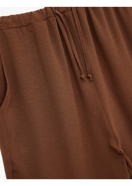 Beli Bağcıklı Regular Fit Havuç Kesim Pantolon modelleri