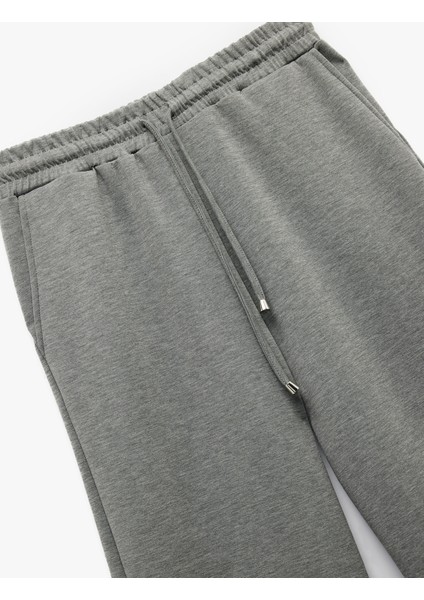 Regular Fit Modal Karışımlı Cepli Beli Bağlamalı Düz Bol Paça Eşofman Altı fırsatları