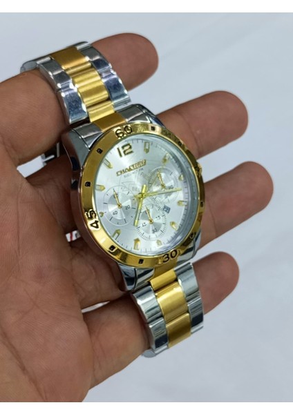 çelik kordonlu, metalik üstüne altın sarısı kaplama, takvim göstergeli, su geçirmez, 2 yıl garantili Erkek Kol Saati fiyatları