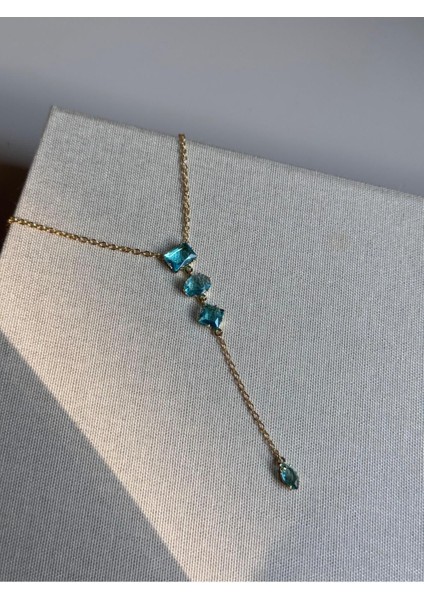 Mavi Baget Taşlı Uzun Y Kolye – Altın Renk Işıltılı ve Zarif Kadın Takı