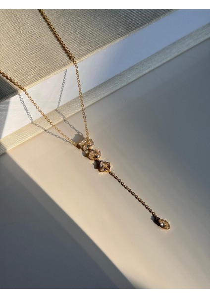 Baget Taşlı Uzun Y Kolye – Altın Renk Işıltılı ve Zarif Kadın Takı fiyatları