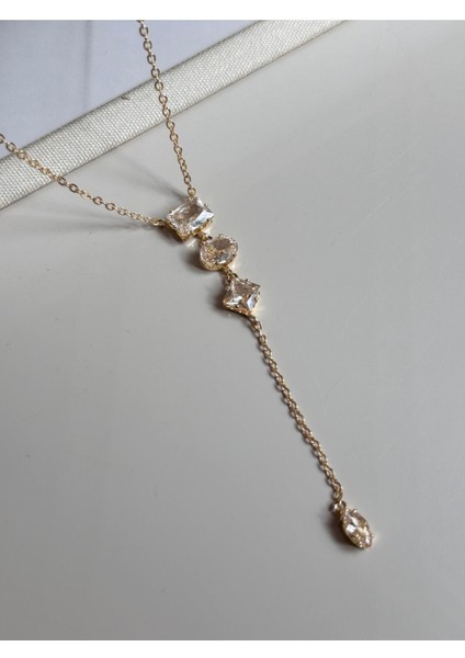 Baget Taşlı Uzun Y Kolye – Altın Renk Işıltılı ve Zarif Kadın Takı fırsatları