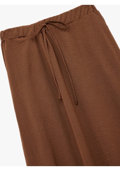 Aerobin Kumaş Midi Boy Çan Kesim Kloş Etek modelleri