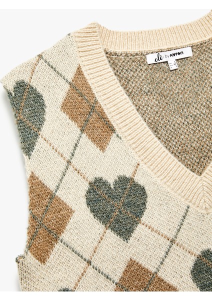 Kalp Desenli V Yaka Kolsuz Triko Süveter indirimleri