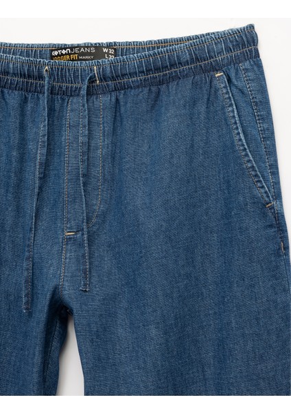 Pamuklu Cep Detaylı Beli Bağcıklı Bol Kalıp Jean Pantolon modelleri