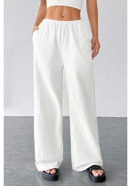 - Kadın Beyaz Bol Kesim Cepli Geniş Paça Dökümlü Pantolon
