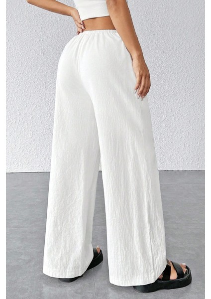 - Kadın Beyaz Bol Kesim Cepli Geniş Paça Dökümlü Pantolon fiyatları