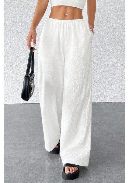 - Kadın Beyaz Bol Kesim Cepli Geniş Paça Dökümlü Pantolon indirimleri