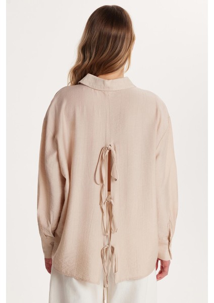 Kadın Regular Fit Uzun Kollu Sırt Bağlama Detaylı Taş Gömlek indirimleri