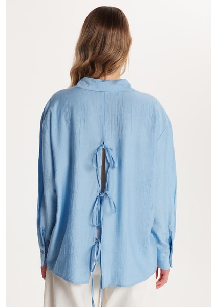 Kadın Regular Fit Uzun Kollu Sırt Bağlama Detaylı Mavi Gömlek indirimleri