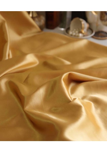 Asetat Saten Dökümlü Kumaş Gold Renktedir