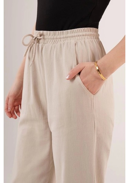 Cepli Belden Bağlamalı Paça Detaylı Krem Pantolon modelleri