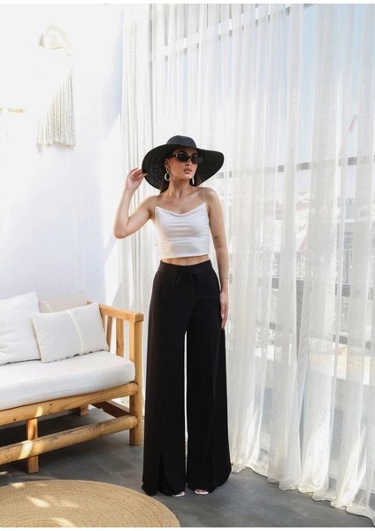 Keten Önü Çapraz Parçali Lasti̇kli̇ ve Bağcikli Geni̇ş Paça Pantolon