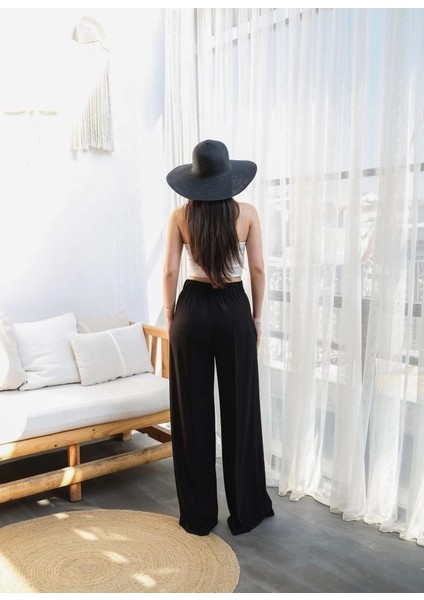 Keten Önü Çapraz Parçali Lasti̇kli̇ ve Bağcikli Geni̇ş Paça Pantolon fiyatları