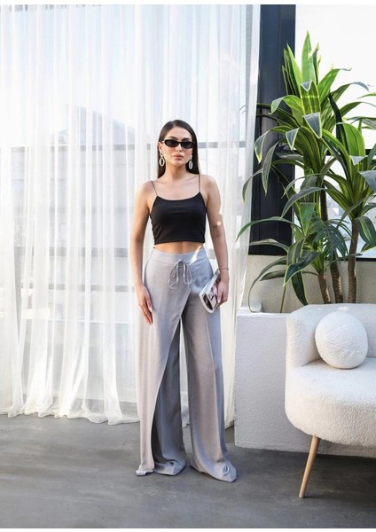 Keten Önü Çapraz Parçali Lasti̇kli̇ ve Bağcikli Geni̇ş Paça Pantolon fırsatları