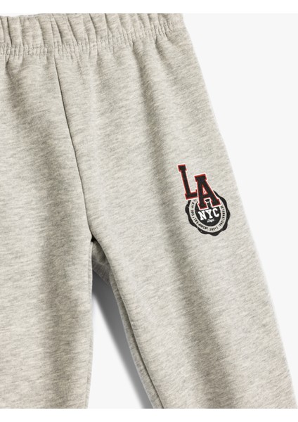 Jogger Eşofman Altı Beli Bağlamalı Slogan Baskı Detaylı Şardonlu modelleri