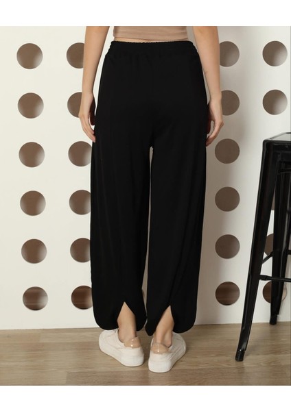 Özgü Giyim Butik Bn Tensel Arka Paça Yırtmaç Detaylı Siyah Şalvar Pantolon fiyatları