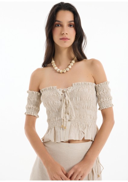 Kuş Gözü Bağlamalı Düşük Omuz Bluz Bej fırsatları