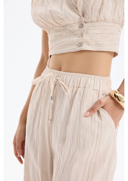 Kırışık Görünümlü Beli Lastikli Pantolon Bej fırsatları