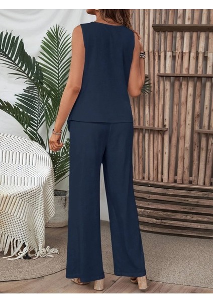 Kadın Kolsuz Düğmeli Asimetrik Detaylı Bürümcük Bluz ve Pantolon Takım fırsatları