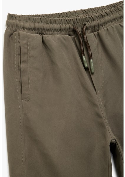Cepli Beli Lastikli Bağlamalı Loose Fit Jogger Paraşüt Pantolon modelleri