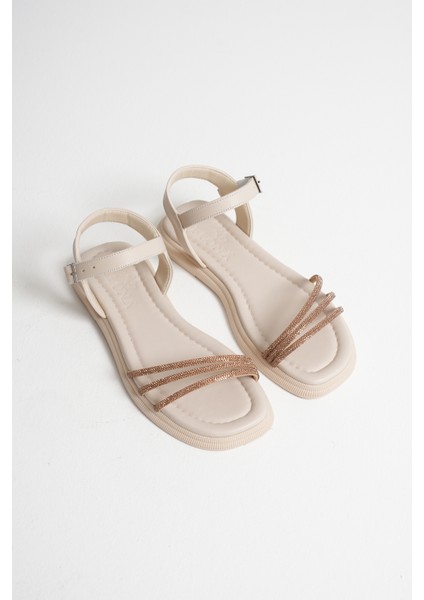 Kadın Spiral Şerit Taşlı Bilekten Bantlı Düz Taban Bej Sandalet