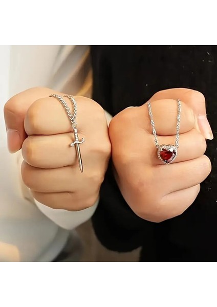 Kararmaz Çelik Kalp Kılıç Kolye ve Kokulu Pembe Lotus Mum Hediye Seti Pamuk Prenses ve Avcı Kolye indirimleri