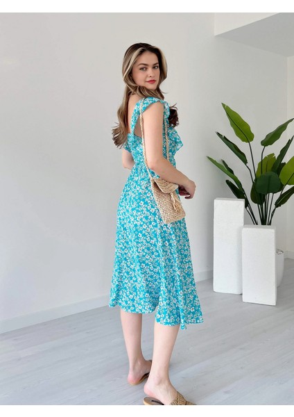 Kare Yaka Çiçek Desen Sırtı Gipeli Beli Lastikli ve Bağcıklı Midi Boy Viskon Elbise modelleri