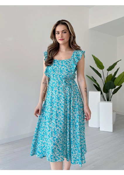 Kare Yaka Çiçek Desen Sırtı Gipeli Beli Lastikli ve Bağcıklı Midi Boy Viskon Elbise fırsatları