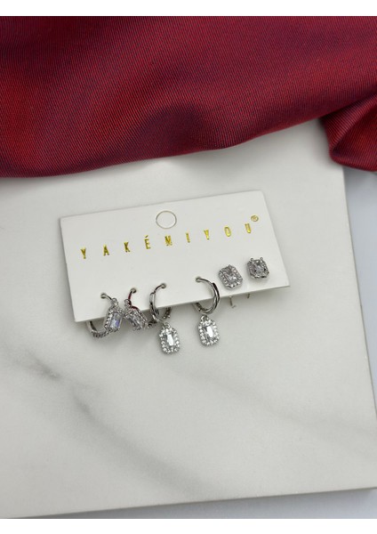 6'lı Baget Tektaşlı Pırlanta Işçiliği Tasarım Zirkon Taşlı Marka Model Çelik Küpe modelleri