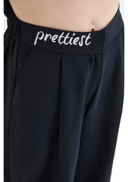 Beli Yazı Baskılı Bol Paça Pantolon Siyah fırsatları