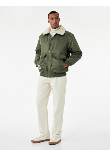 Uzun Kollu Cepli Etiket Detaylı Peluş Yaka Mont fiyatları