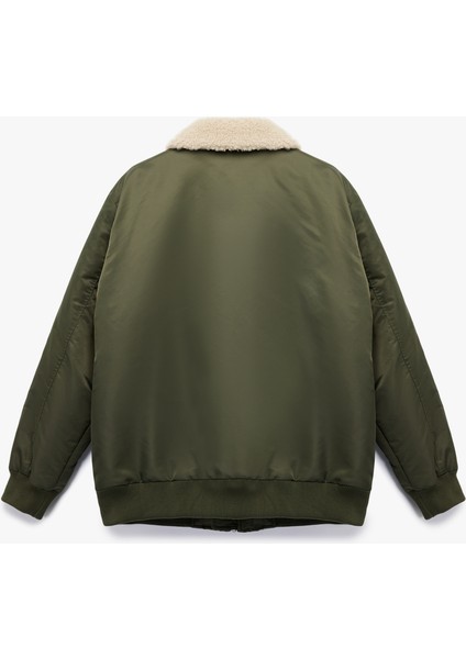 Uzun Kollu Cepli Etiket Detaylı Peluş Yaka Mont fırsatları