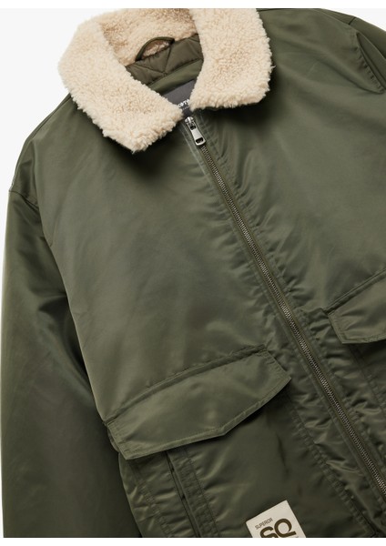 Uzun Kollu Cepli Etiket Detaylı Peluş Yaka Mont indirimleri