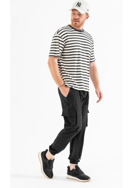 Erkek Siyah Likralı Esnek Ince Kumaş Lastikli Paça Torba Cep Pantolon modelleri