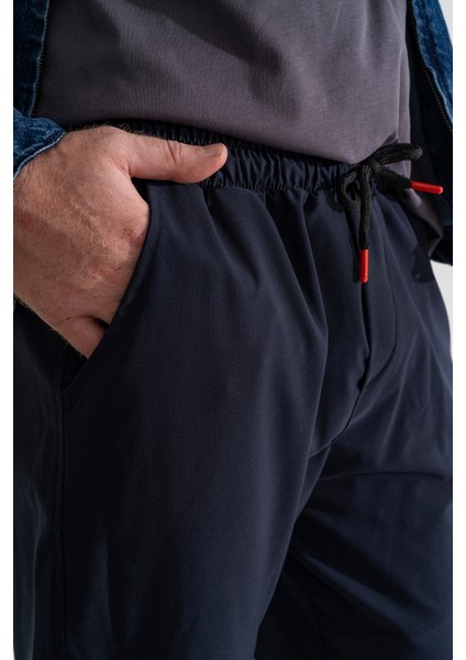 Erkek Lacivert Nefes Alan Likralı Esnek Kumaş Dar ve Bilek Paça Jogger Pantolon indirimleri