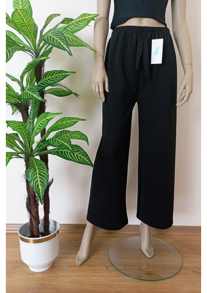 Kadın Siyah Dökümlü Krep Kumaş Beli Lastikli Bol Paça Pantolon indirimleri