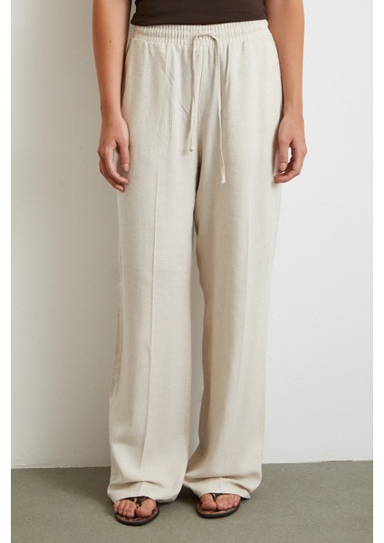 Beli Lastikli Boru Paça Pantolon Bej indirimleri