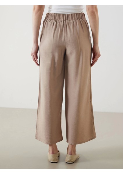 Lcw Modest Bej Beli Lastikli Geniş Paça Kadın Pantolon fırsatları