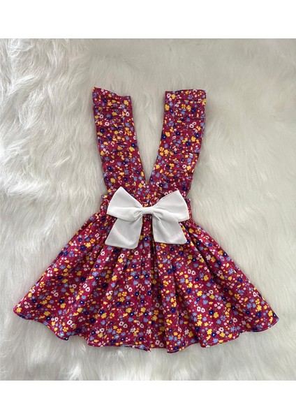 Kız Çocuk Bordo Çiçekli Fiyonklu Fırfır Askılı Salopet Elbise (%100 Pamuk Kumaştan Üretilmiştir.)